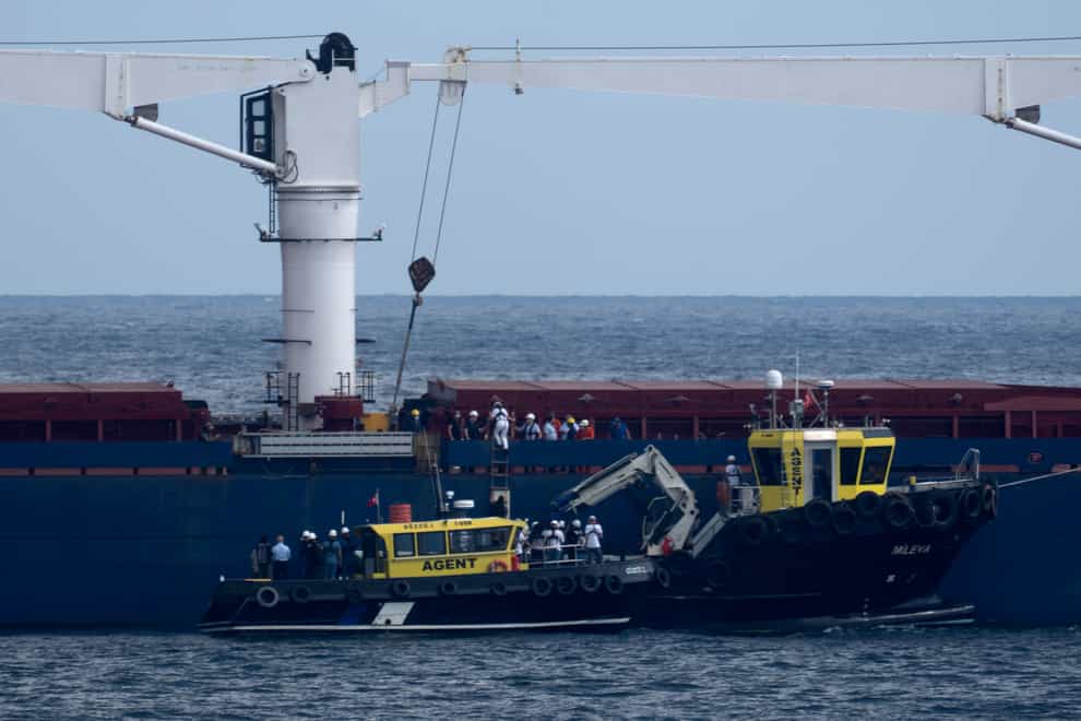 Russian, Ukrainian, Turkish and UN officials visit the cargo ship Razoni (Khalil Hamra/AP)