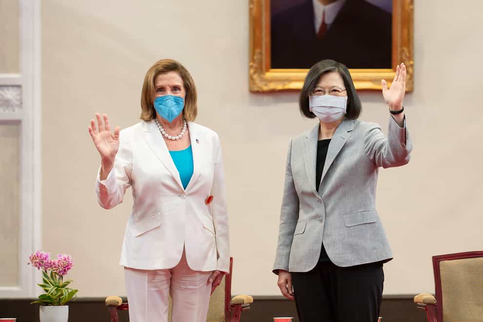 US house speaker Nancy Pelosi, left, and Taiwanese President Tsai Ing-wen wave during a meeting in Taipei, Taiwan (Taiwan Presidential Office via AP)
