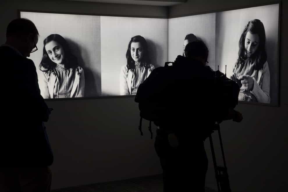 Journalists take images at the Anne Frank House museum in Amsterdam, Netherlands (Peter Dejong/AP)