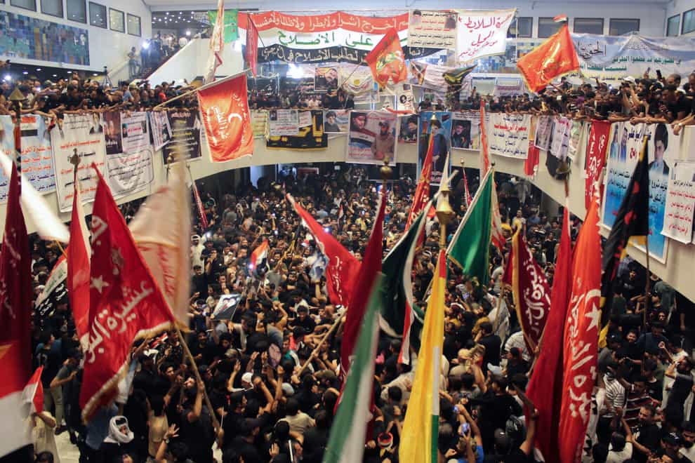 Followers of Shiite cleric Muqtada al-Sadr outside the parliament building during a sit-in protest (Adil al-Khazali/AP)