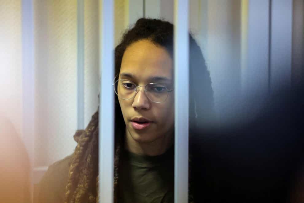 WNBA star and two-time Olympic gold medalist Brittney Griner stands behind bars in a courtroom for a hearing, in Khimki just outside Moscow, Russia, Tuesday, Aug. 2, 2022. Since Brittney Griner last appeared in her trial for cannabis possession, the question of her fate expanded from a tiny and cramped courtroom on Moscow’s outskirts to the highest level of Russia-US diplomacy. (Evgenia Novozhenina/Pool Photo via AP)