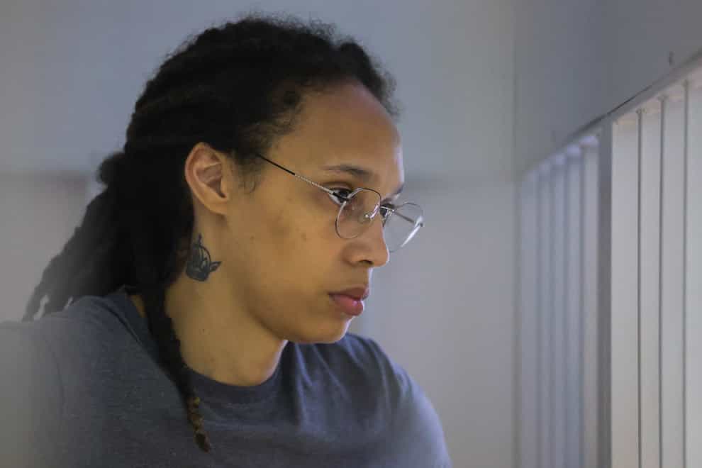 WNBA star and two-time Olympic gold medalist Brittney Griner stands listening to a verdict in a courtroom in Khimki just outside Moscow, Russia, Thursday, Aug. 4, 2022. American basketball star Brittney Griner apologized to her family and teams as a Russian court heard closing arguments in her drug possession trial said it expected to deliver a verdict later Thursday. (Evgenia Novozhenina/Pool Photo via AP)