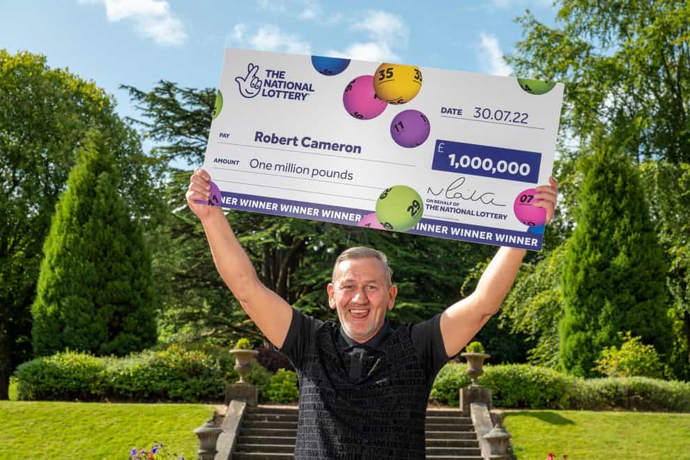 Robert Cameron, 53, won £1 million on the Lotto after he followed the advice of his late mother (National Lottery/PA)