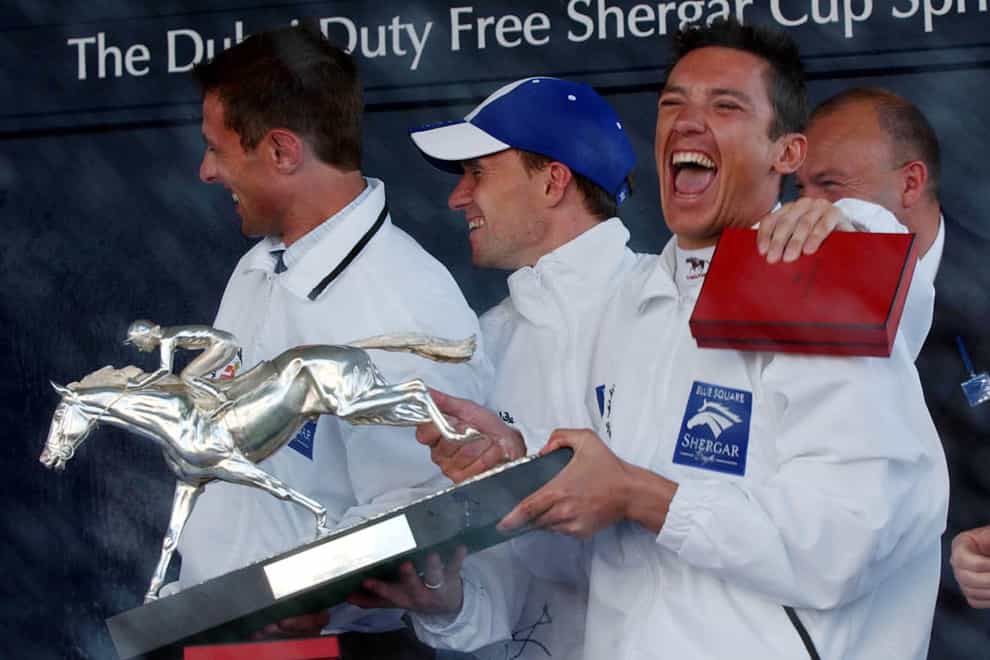 Frankie Dettori, team captain of the Rest of the World team laughs as champagne is sprayed on photographers at Ascot (Rebecca Naden/PA)