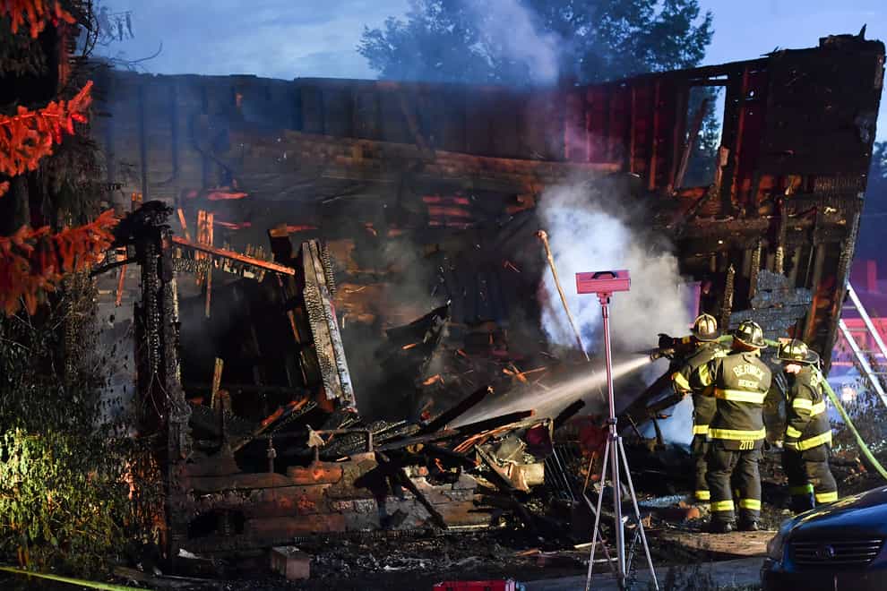 Firefighters tackle the blaze (Jimmy May/Bloomsburg Press Enterprise via AP)
