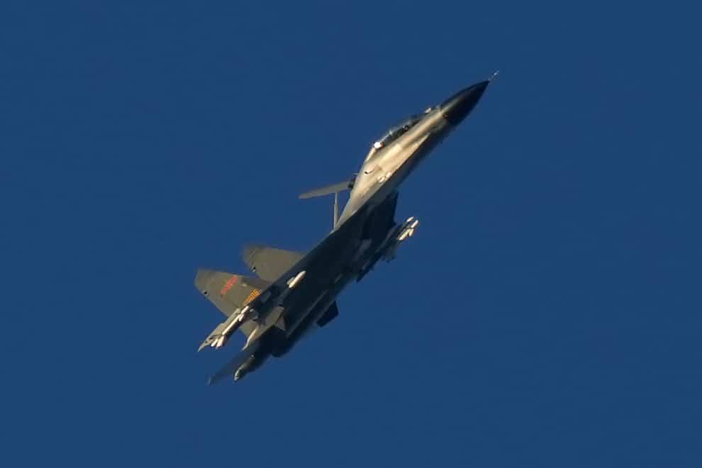 A Chinese J-11 military fighter jet flies above the Taiwan Strait near Pingtan, the closest land of mainland China to the island of Taiwan, in Pingtan in south-eastern China’s Fujian Province, on Friday (Ng Han Guan/AP)