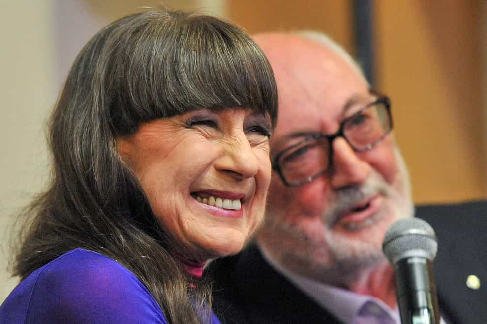 Seekers lead singer Judith Durham with fellow band member and guitarist Athol Guy at a media conference in Melbourne, Australia, in 2013 (Julian Smith/AAP Image via AP)