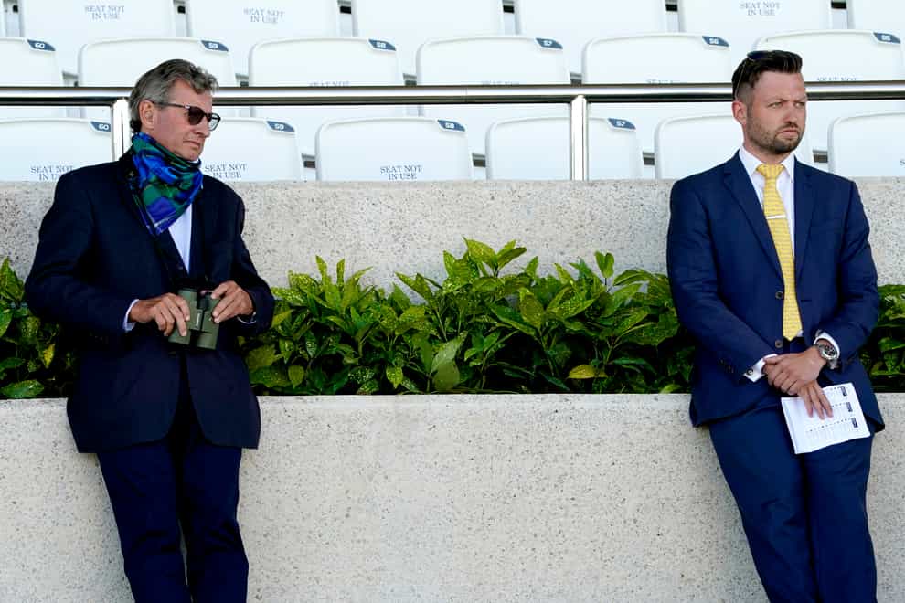 Trainer Mark Johnston (left) and his son Charlie Johnston watch the race action during day three of the Goodwood Festival at Goodwood Racecourse, Chichester.