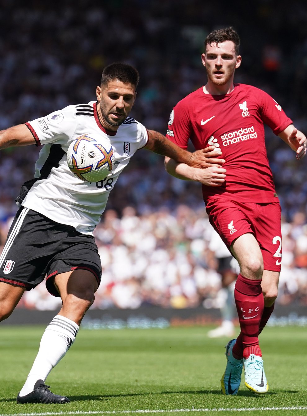 Fulham’s Aleksandar Mitrovic, left, struck twice but Liverpool grabbed a late equaliser at Craven Cottage (Adam Davy/PA)