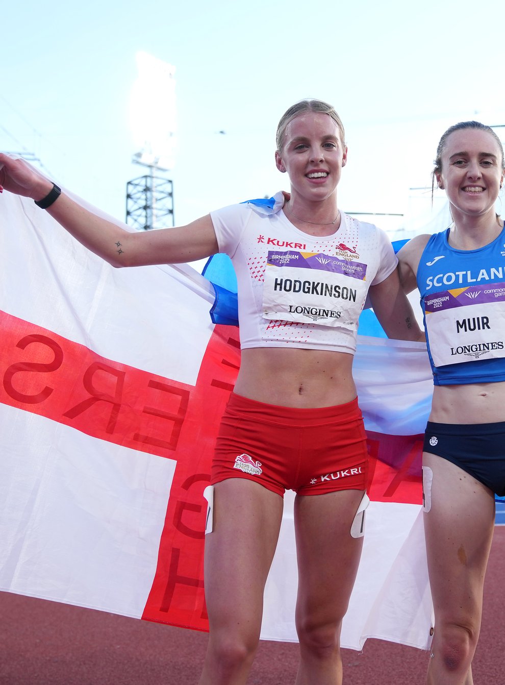 England’s Keely Hodgkinson, left, celebrates wining silver with Laura Muir, who took bronze (Martin Rickett/PA)
