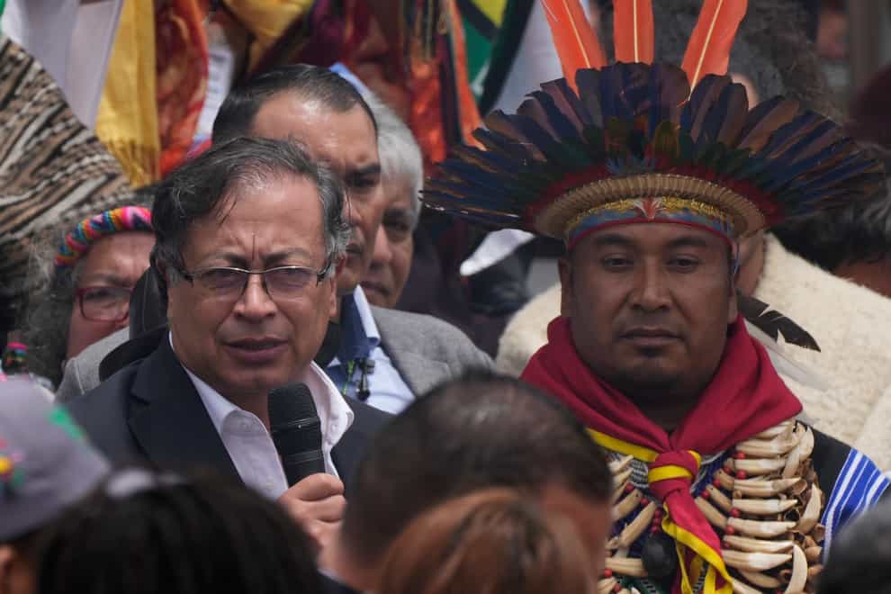 President-elect Gustavo Petro, left, speaks to supporters during a “popular and spiritual” inauguration ceremony presided over by local Indigenous groups and feminist activists (Ariana Cubillos/AP)