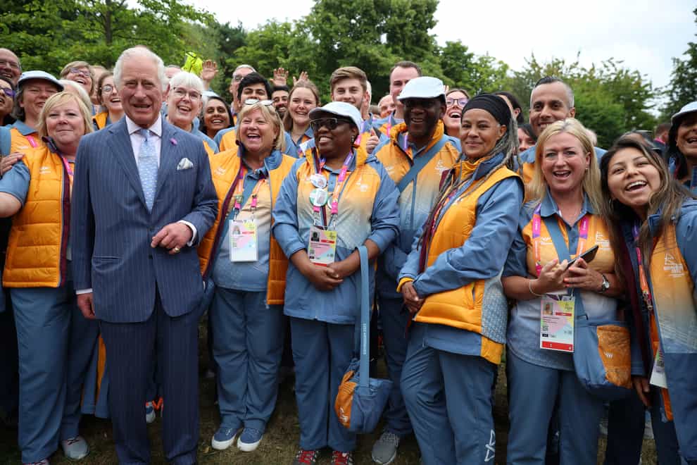 Commonwealth volunteers meet the Prince of Wales on the day of the opening ceremony (Phil Noble/PA)