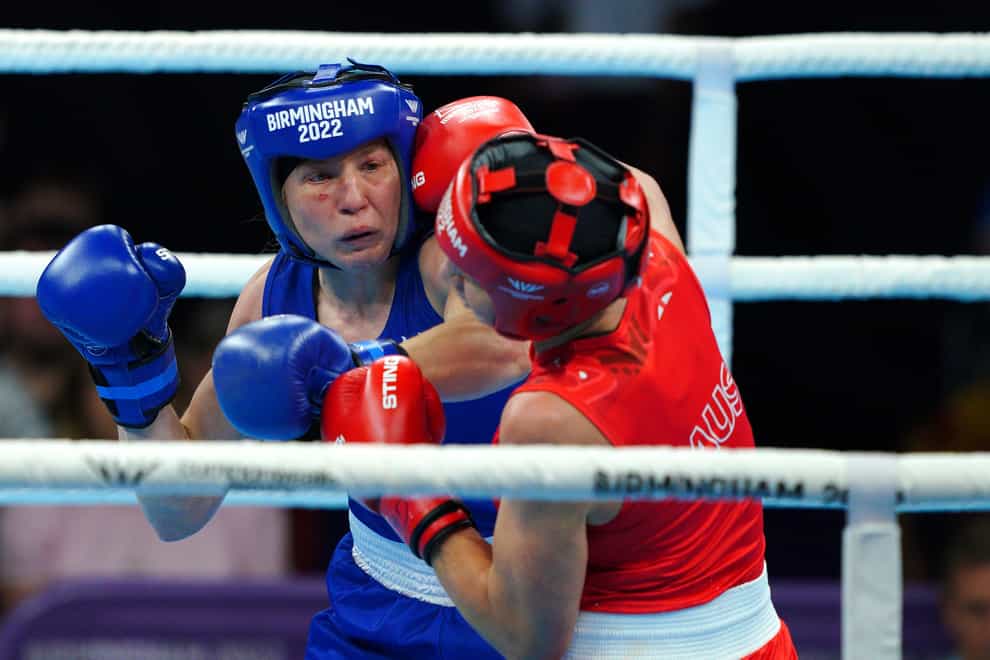 Rosie Eccles (blue) stopped Australia’s Kaye Scott to claim boxing gold (Peter Byrne/PA)