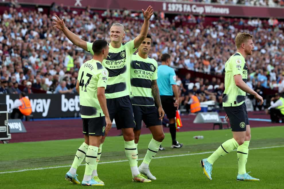 Manchester City’s Erling Haaland, second left, celebrates scoring at West Ham (Kieran Cleeves/PA)