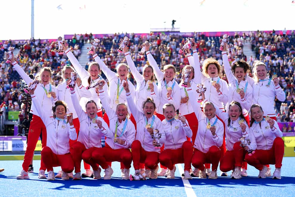 The England team celebrate with their gold medals after winning the women’s hockey final against Australia (Joe Giddens/PA)