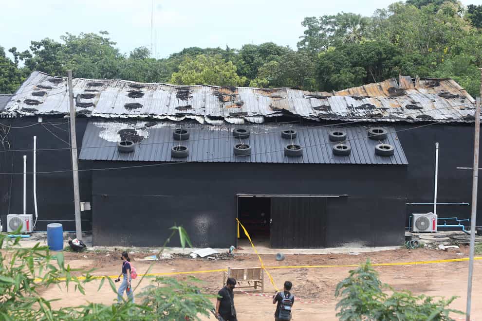 Exterior damage from a fire is seen at the Mountain B pub in the Sattahip district of Chonburi province, about 160 kilometers (100 miles) southeast of Bangkok. Over a dozen people were killed and dozens injured when a fire broke out early Friday morning at the crowded music pub, police and rescue workers said (Anuthep Cheysakron/AP/PA)