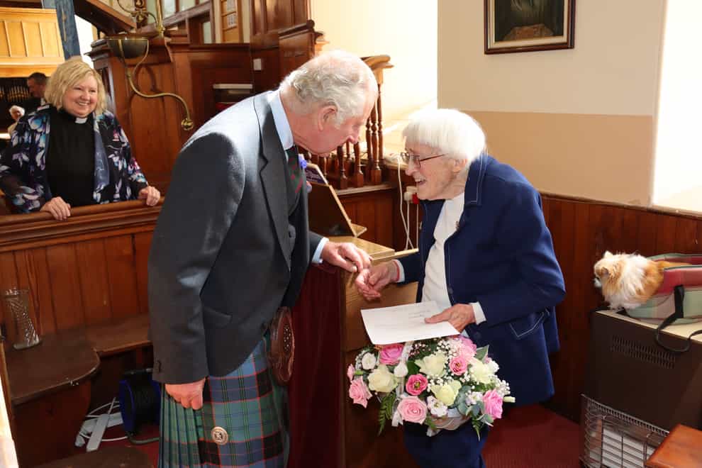 Mary Edmondson was presented with a basked of flowers (Neil Buchan/PA)