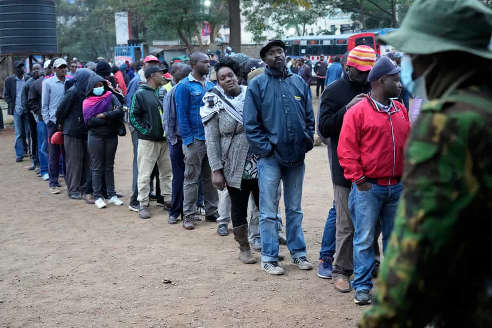 People line up to vote at the Moi Avenue Primary School in Nairobi (Khalil Senosi/AP)