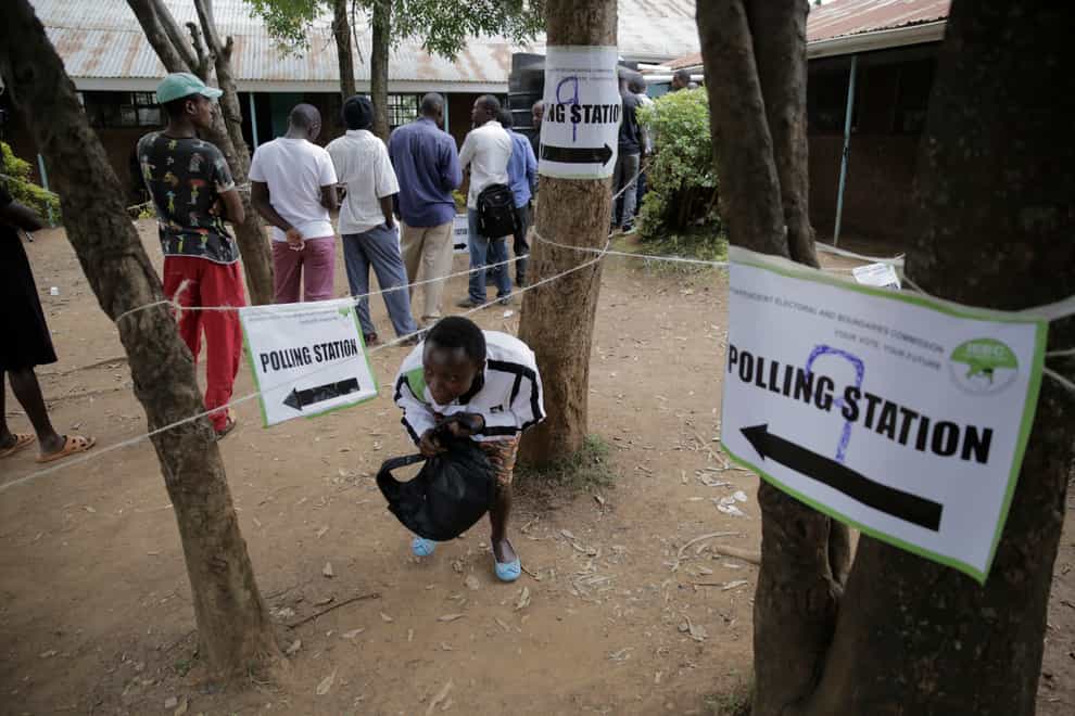 People line up to cast their vote in Kenya’s general election (Brian Inganga/AP)