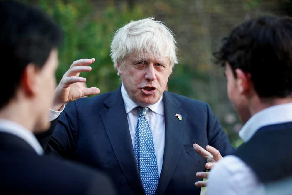 Prime Minister Boris Johnson talking to guests during a Points of Light reception at Downing Street, London (Peter Nicholls/PA)