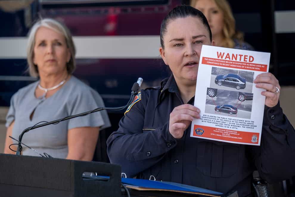 Albuquerque Police Deputy Chief of Investigations Cecily Barker holds a flyer with photos of a car wanted in connection with Muslim men (Adolphe Pierre-Louis/AP)