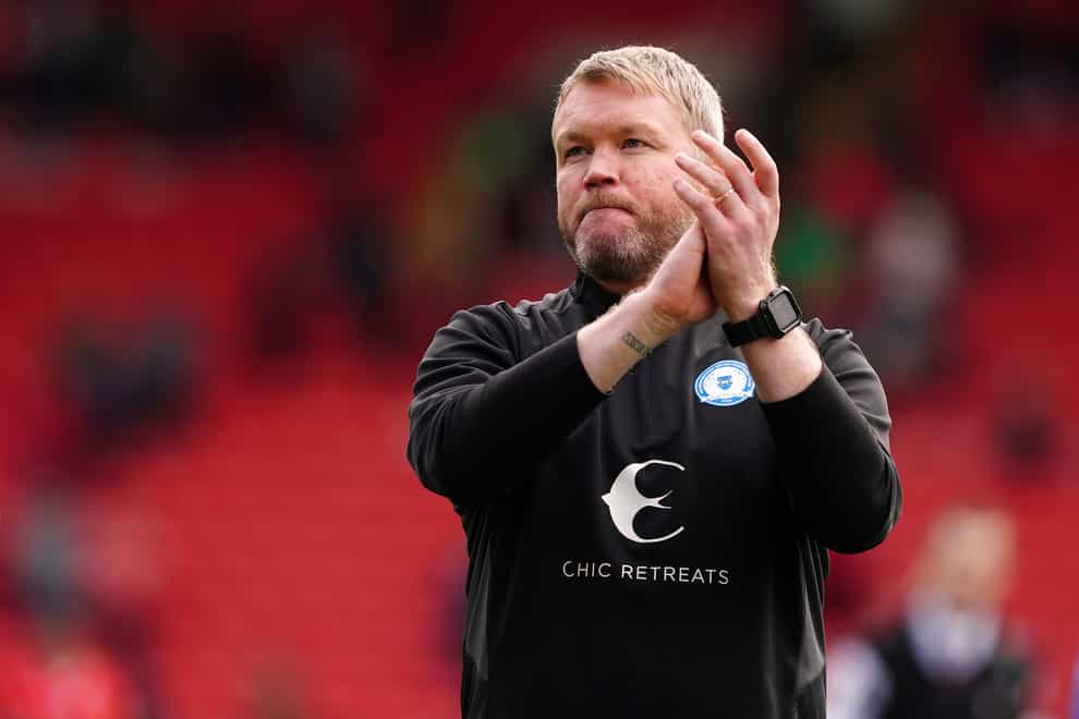 Peterborough boss Grant McCann was delighted to progress in the Carabao Cup (Martin Rickett/PA)