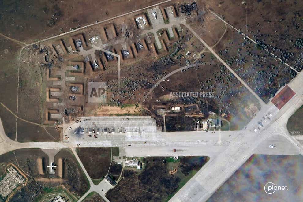 This satellite image provided by Planet Labs PBC shows destroyed Russian aircraft at Saki Air Base after an explosion Tuesday, Aug. 9, 2022, in the Crimean Peninsula, the Black Sea peninsula seized from Ukraine by Russia and annexed in March 2014. Ukraine’s air force said Wednesday, Aug. 10, 2022 that nine Russian warplanes were destroyed in a deadly string of explosions at an air base in Crimea that appeared to be the result of a Ukrainian attack, which would represent a significant escalation in the war. (Planet Labs PBC via AP)