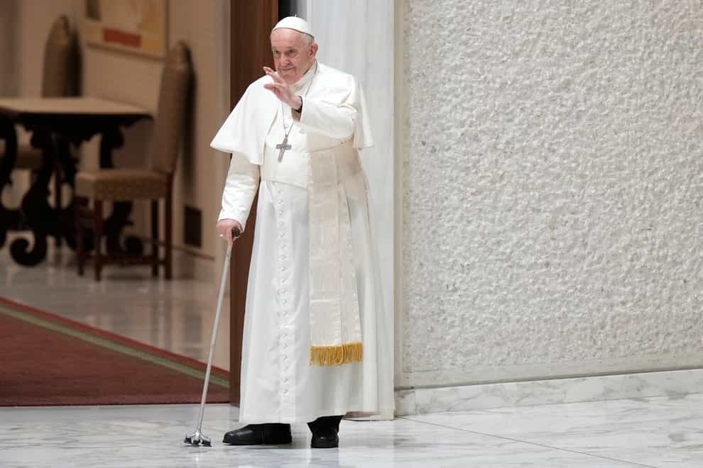 Pope Francis waves to faithful as he arrives in the Paul VI hall for his the weekly general audience at the Vatican on Wednesday, August10, 2022 (Andrew Medichini/AP/PA)