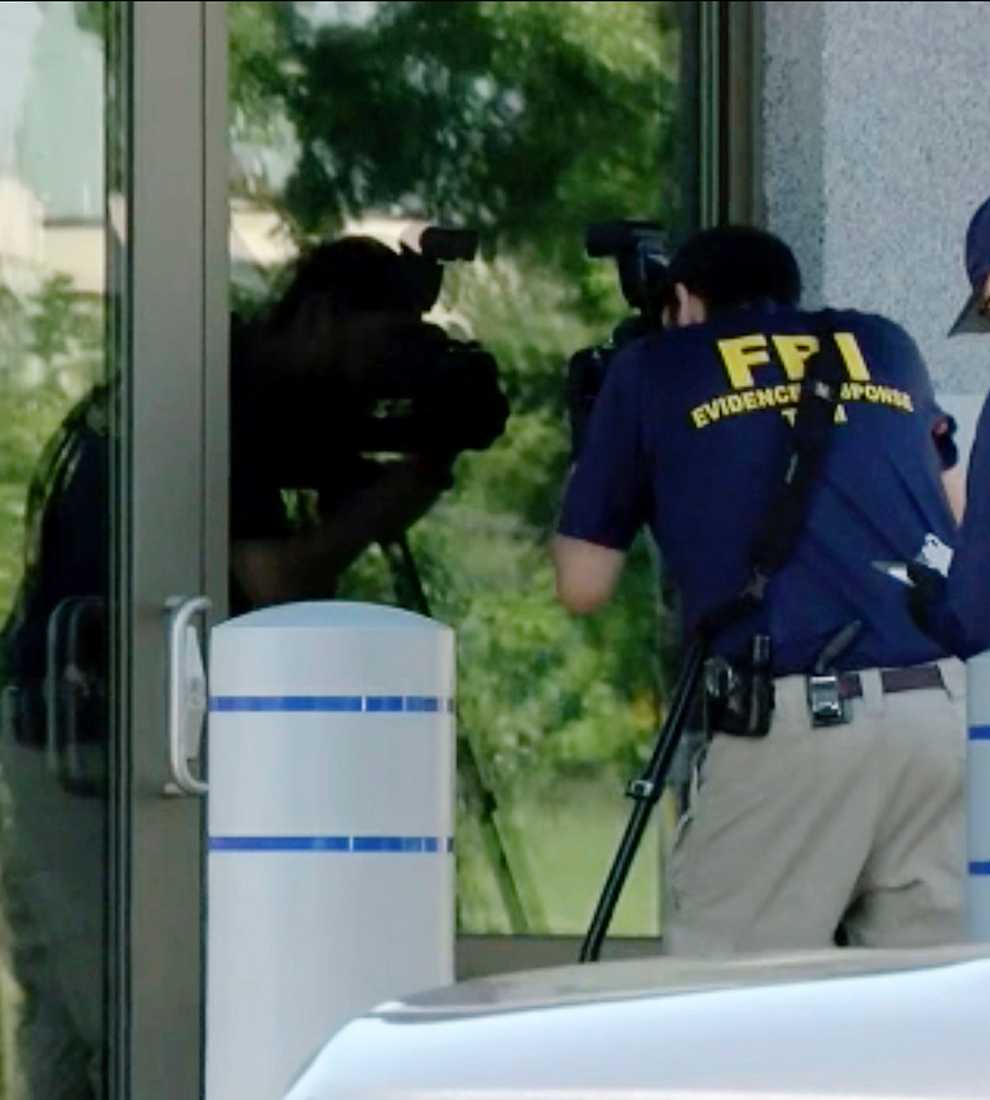 Members of the FBI Evidence Response Team work outside the FBI building in Kenwood, Ohio (WKEF/WRGT/AP/PA)