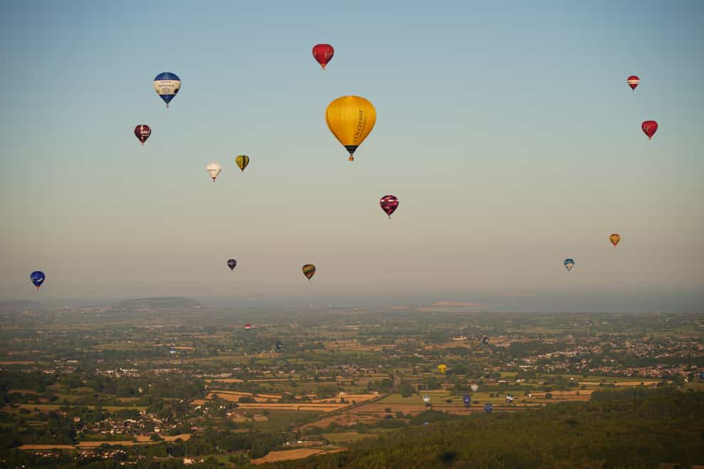Balloons fly over Bristol, during the Bristol International Balloon Fiesta 2022 (Ben Birchall/PA)