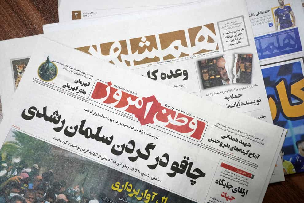 The front pages of the August 13 edition of Iranian newspapers (AP)