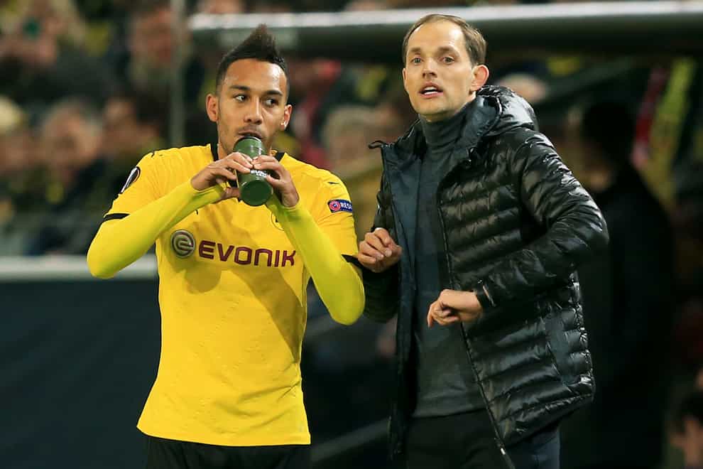 Barcelona are thought to be ready to negotiate over Pierre-Emerick Aubameyang, left, who could reunite with Thomas Tuchel, right (Adam Davy/PA)