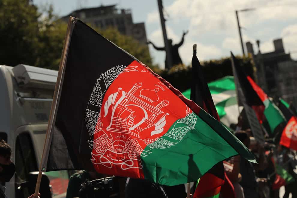 People waving Afghan flags attend a protest against Taliban persecution of women on Dublins O’Connell Street organized by the Afghan Union of Ireland. Picture date: Sunday September 19, 2021.