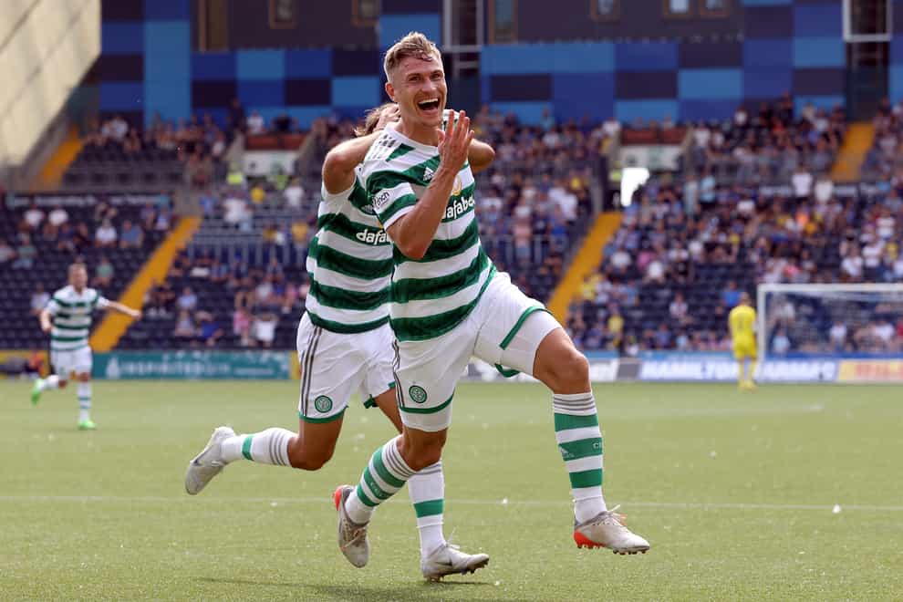 Carl Starfelt celebrates his first goal for Celtic (Steve Welsh/PA)