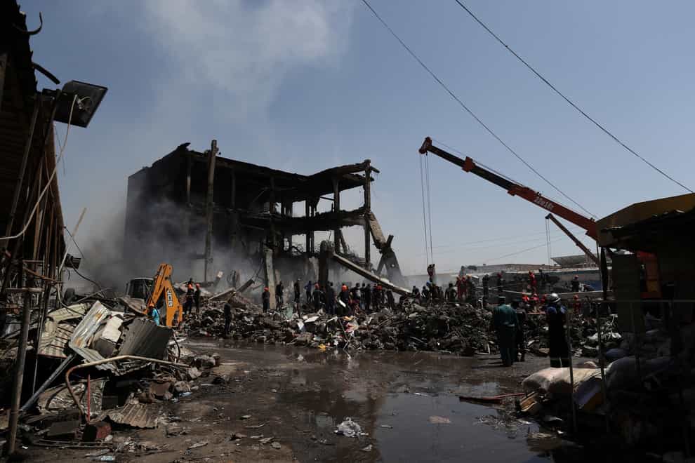 Rescuers work at the site of the explosion (Vahram Baghdasaryan/Photolure/AP)