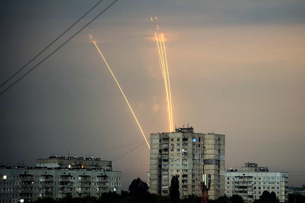 Russian rockets launch against Ukraine from Russia’s Belgorod region are seen at dawn in Kharkiv (Vadim Belikov/AP)