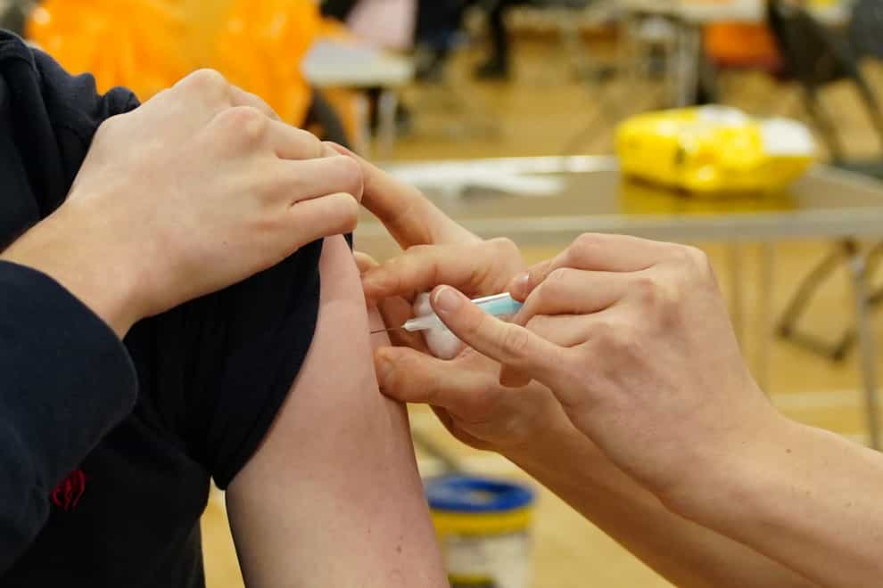 A vaccine being administered (Jane Barlow/PA)