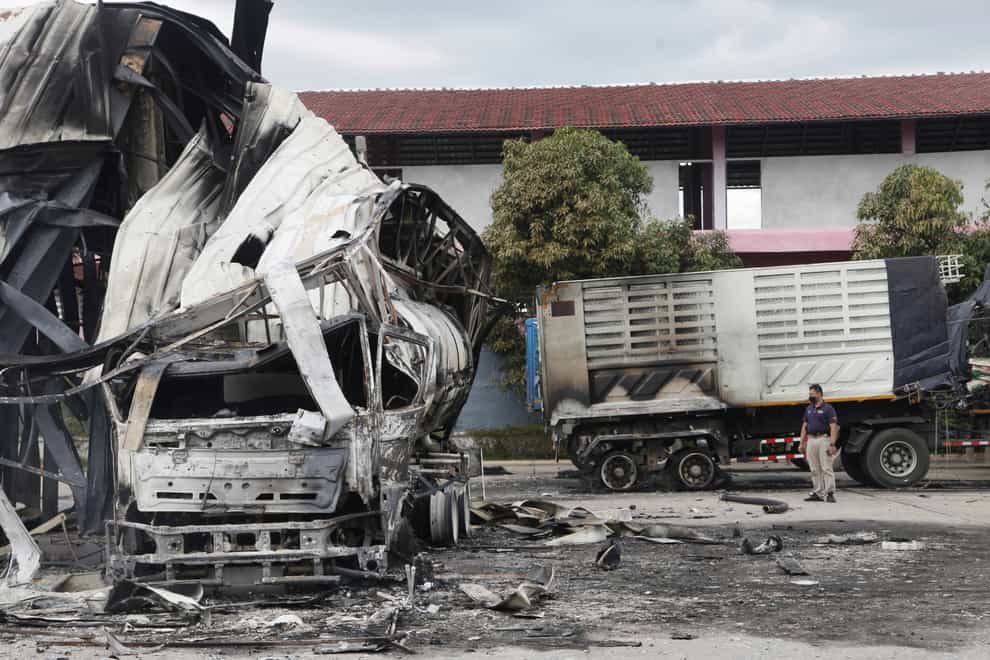 A burnt oil tanker at a petrol station in Pattani province (Sumeth Panpetch/AP)