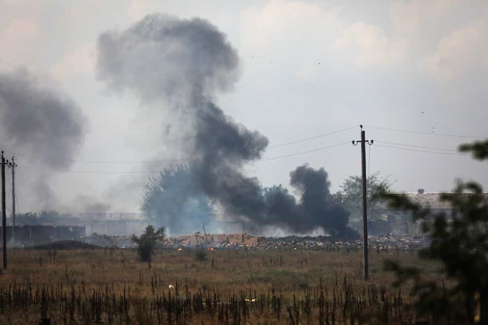Smoke rises over the site of an explosion at a Russian ammunition depot in Crimea (AP)