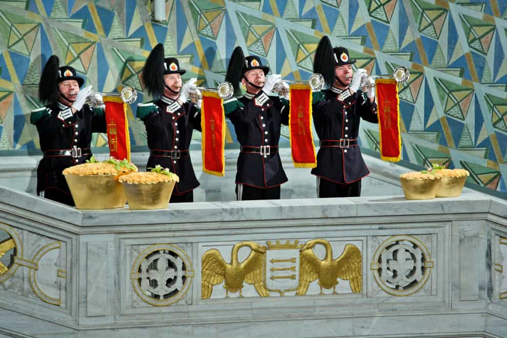 Trumpeters from the Royal Guard play during the Nobel Peace Prize ceremony (Odd Andersen/AP)