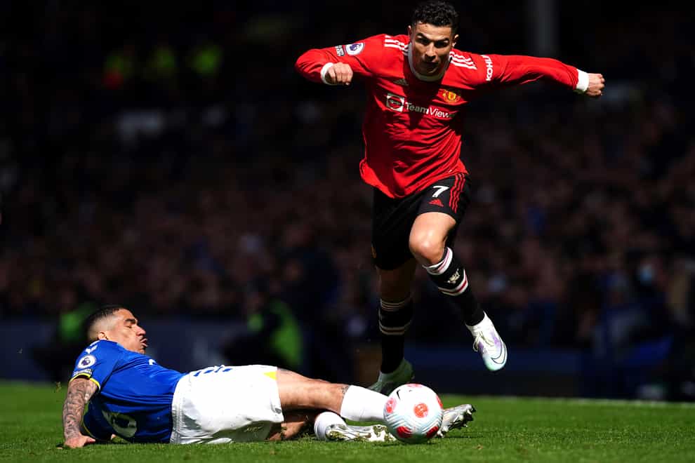Everton’s Allan (left) attempts a tackle on Manchester United’s Cristiano Ronaldo during the Premier League match at Goodison Park, Liverpool, on April 9 (PA)
