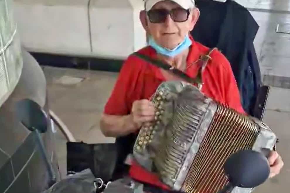 Handout screenshot taken from a video with permission from the Facebook page of Kieran McKenna of Thomas O’Halloran, 87, on his mobility scooter playing the accordian outside Tesco, Perival, west London. Mr O’Halloran who had been riding a mobility scooter on Cayton Road, Greenford, in west London, when he was stabbed to death on Tuesday. Picture date: Wednesday August 17, 2022.
