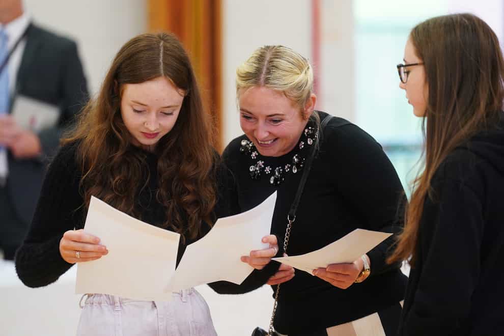 Jessica McGeown (left) opens her A-level results with her mother Samantha McGeown at Lagan College, Belfast (PA)