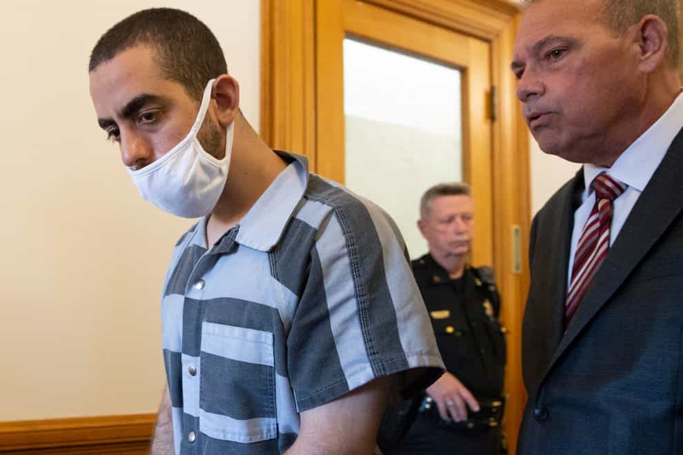 Hadi Matar, 24, left, and defense attorney Nathaniel Barone, right, talk after an arraignment in the Chautauqua County Courthouse in Mayville, N.Y., Thursday, Aug. 18, 2022. Matar was arrested Aug. 12 after he rushed the stage at the Chautauqua Institution and stabbed Salman Rushdie in front of a horrified crowd. (AP Photo/Joshua Bessex)