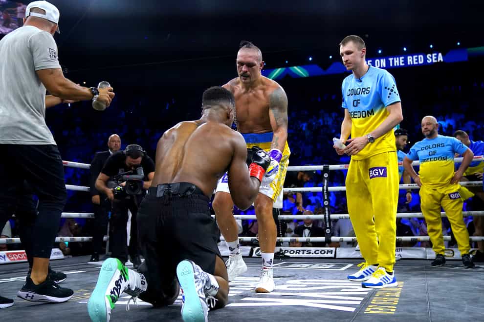 Anthony Joshua and Oleksandr Usyk touch gloves at the end of their fight (Nick Potts/PA)