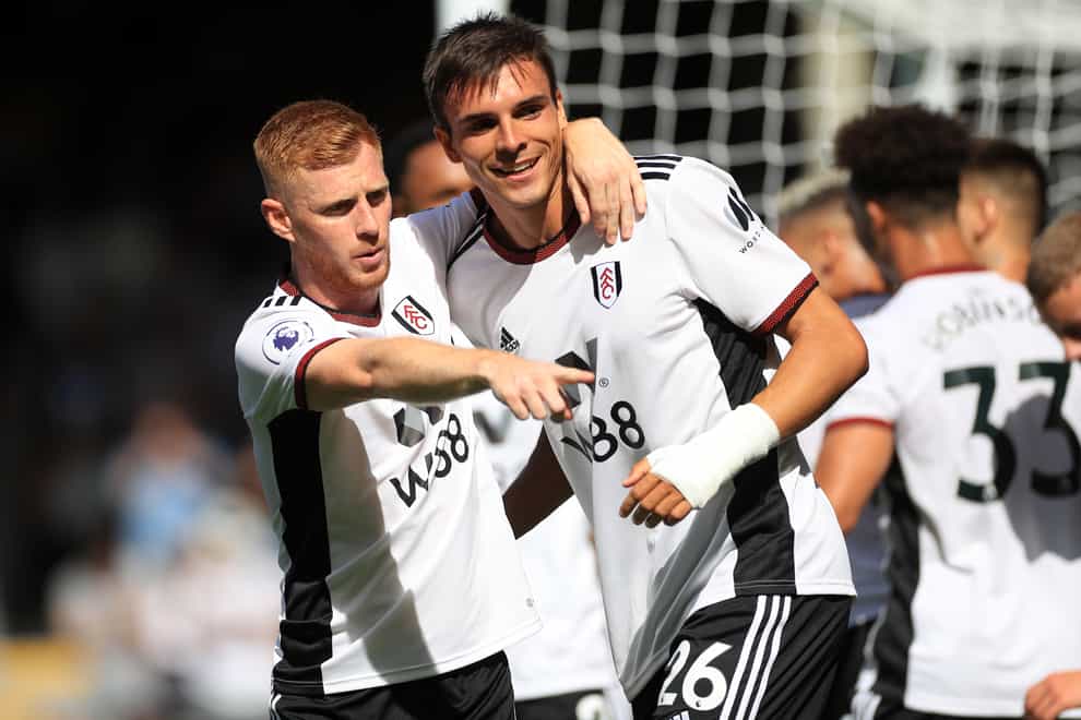 Joao Palhinha, right, celebrates scoring his first goal for Fulham in the 3-2 win over Brentford (Bradley Collyer/PA)