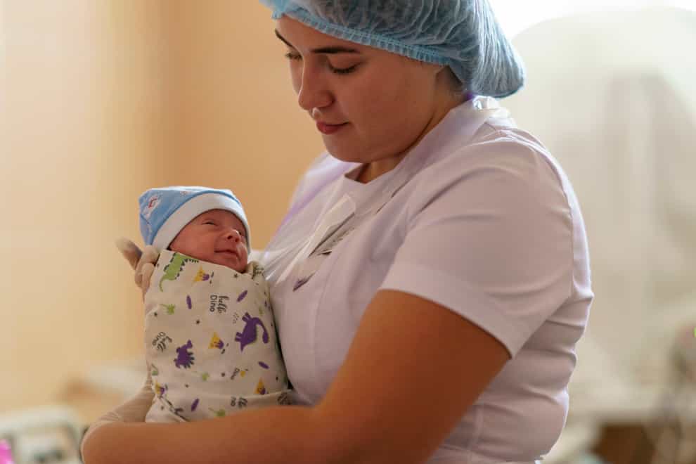 Alina Haupt, an intern-doctor, holds premature baby Veronika (David Goldman/AP)