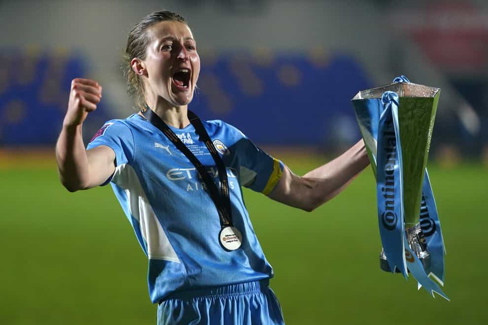 Ellen White celebrates with the League Cup trophy in March (Adam Davy/PA)