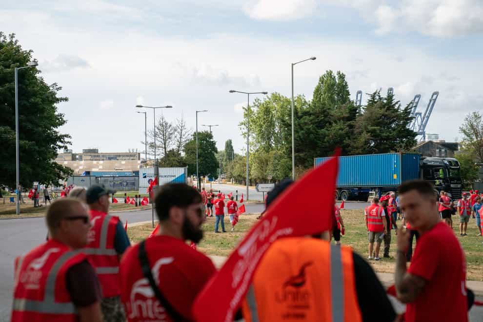 Members of the Unite union man a picket line at one of the entrances to the Port of Felixstowe (Joe Giddens/PA)
