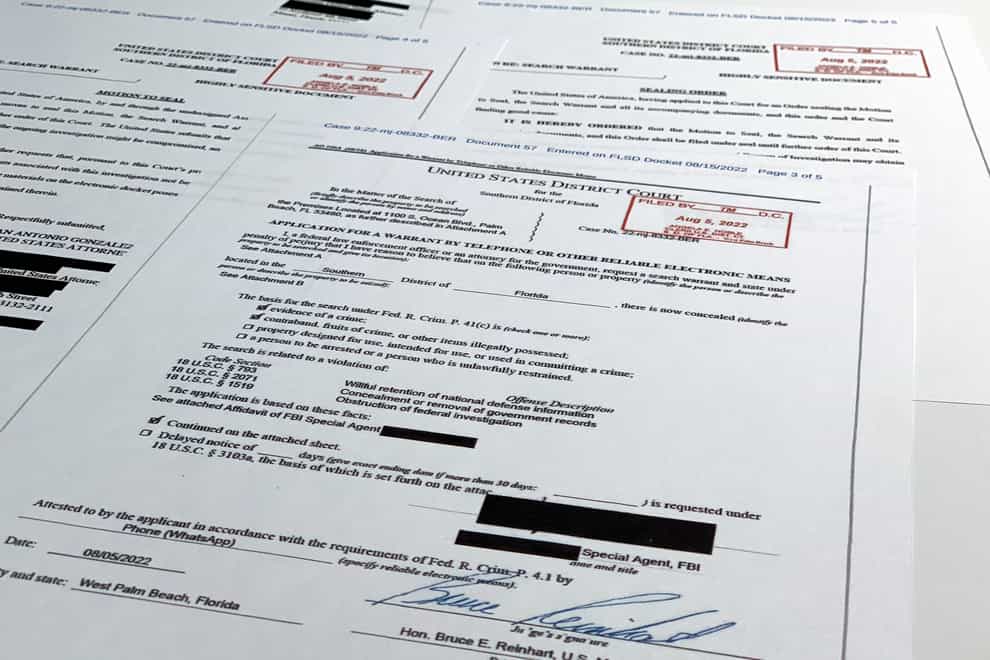 Documents related to the search warrant for former US president Donald Trump’s Mar-a-Lago estate in Palm Beach, Florida (Jon Elswick/AP)